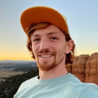 Portrait of Brandon Hansen, in outdoor landscape at sunset in Utah
